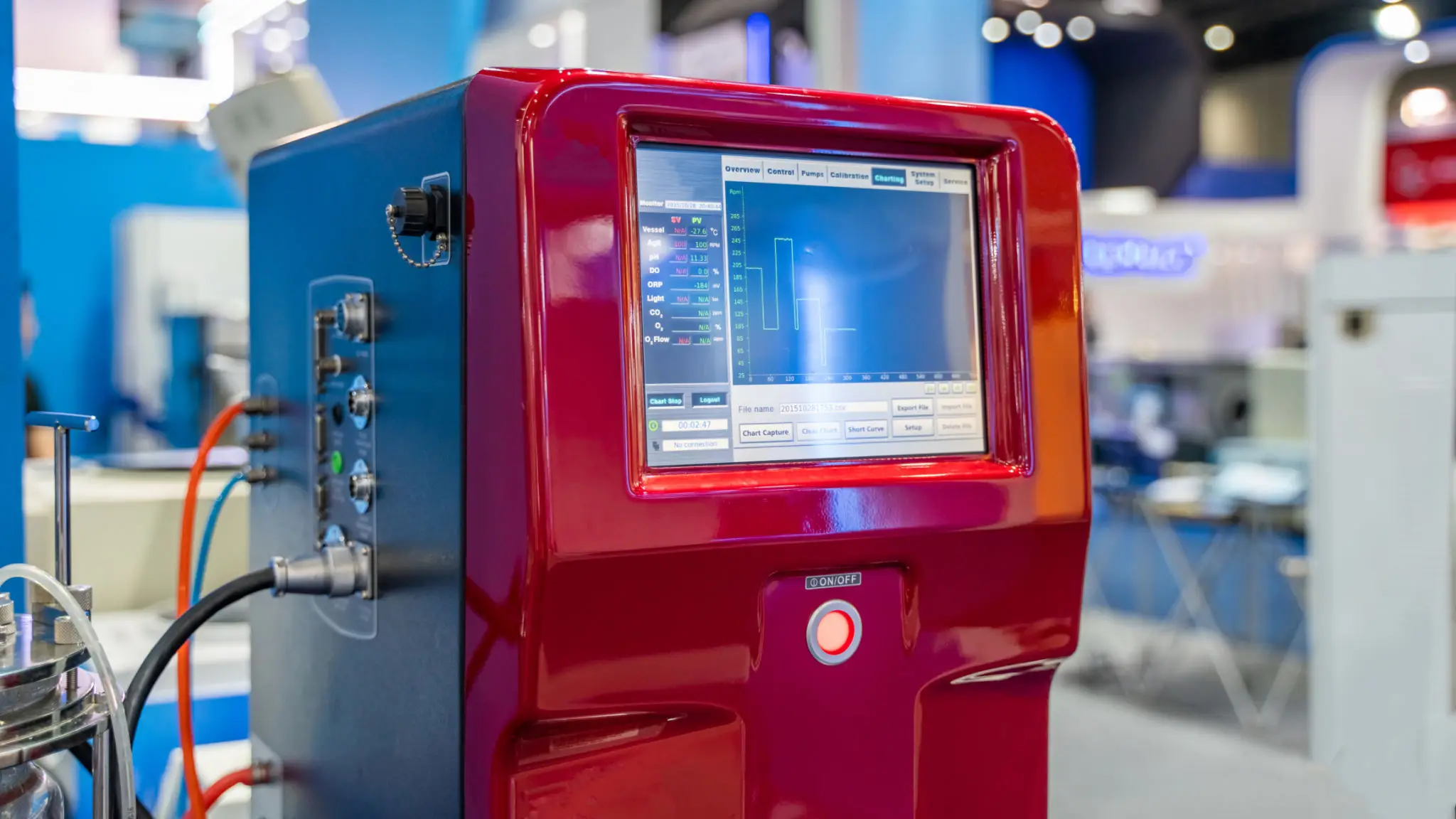Red laboratory instrument with touchscreen chart display