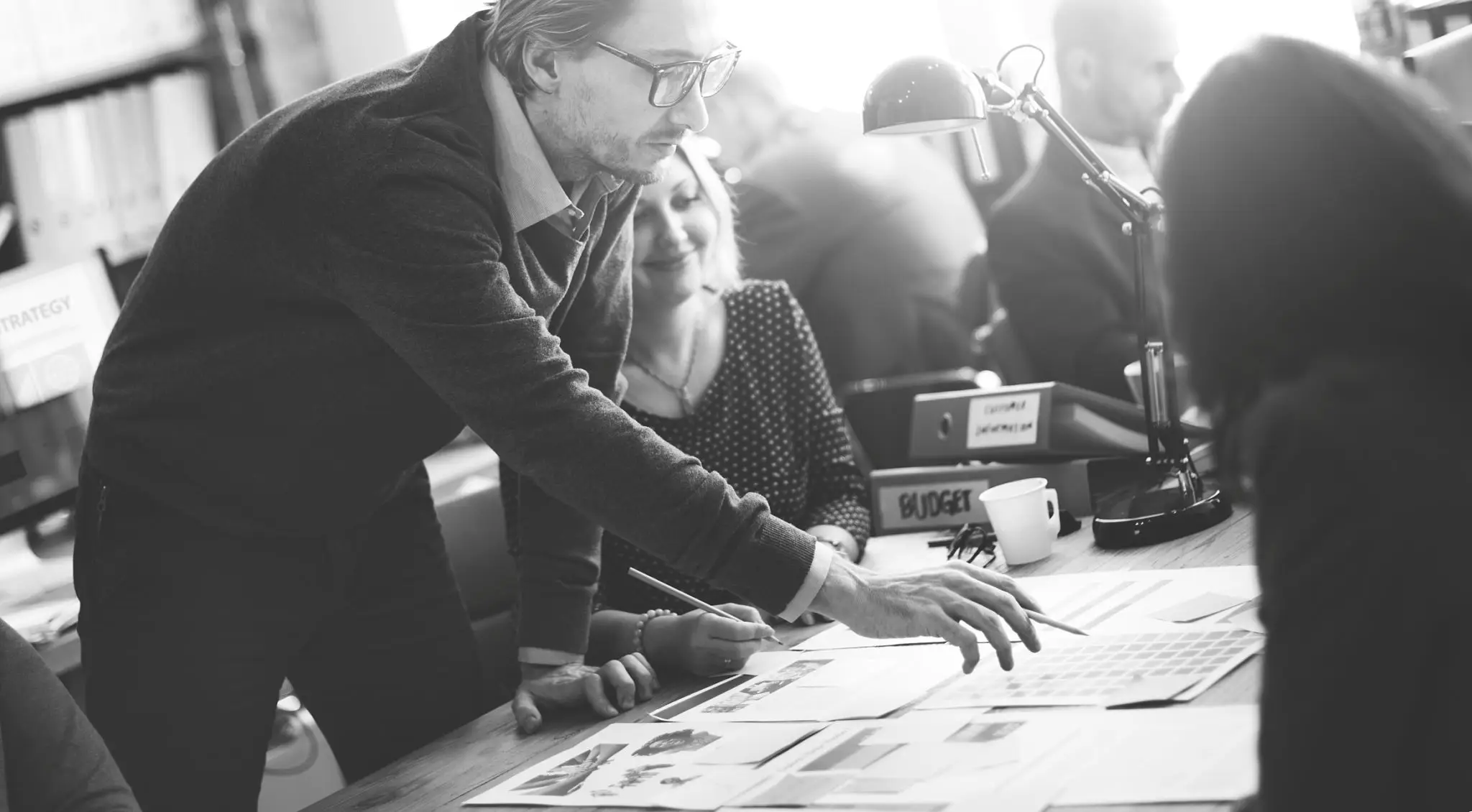 Team reviewing documents at a table