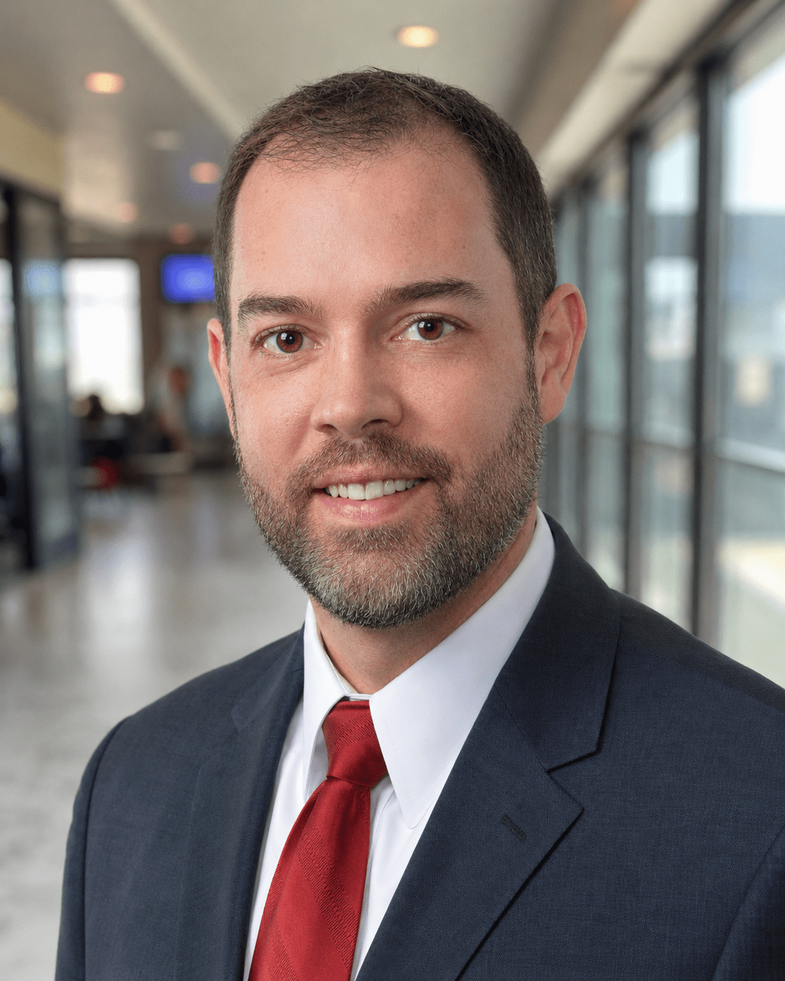 Professional headshot of man in suit